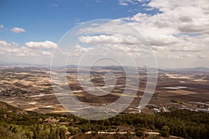 Megido valley, Armageddon battle place with empty fields, cloudy sky, Israel