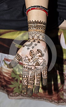 Mehandi Henna design on woman hands