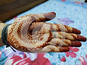 mehandi work by an Indian lady