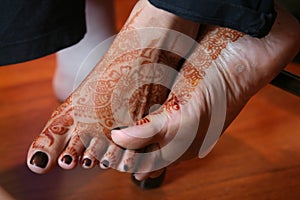 Mehndi decorated feet