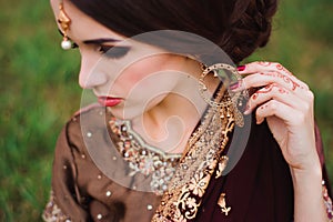 Mehndi tattoo. Woman Hands with black henna tattoos. India national traditions.