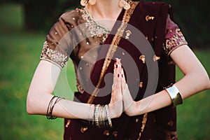 Mehndi tattoo. Woman Hands with black henna tattoos. India national traditions.