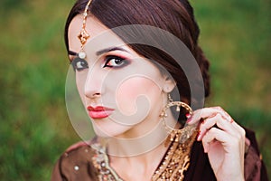 Mehndi tattoo. Woman Hands with black henna tattoos. India national traditions.