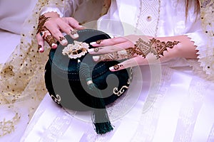 Mehndi tattoo. Woman Hands with black henna tattoos. moroccan national traditions