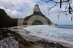 Meio beach in Brazil with a rocky shore on a bright sunny day photo