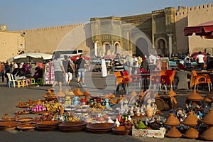Trade in El Hedim Square and Bab Mansour gate in Meknes, Morocco.