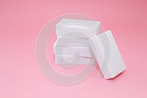 Melamine sponge stack on pink background