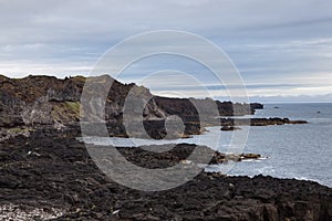 Melancholic Iceland landscape with black volcanic.