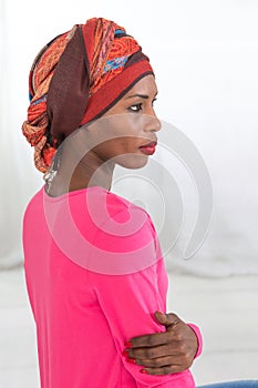 Melancholic and sad woman wearing a headscarf