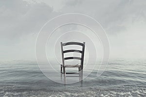 Melancholic scenario of a chair looking toward the infinite photo