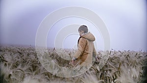 Melancholic Stroll in a Enigmatic Wheat Field in Cozy Outfit