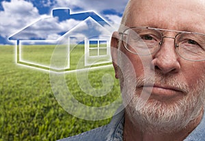 Melancholy Senior Man with Grass Field and Ghosted House Behind