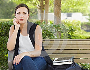 Melancholy Young Adult Woman Sitting on Bench Next