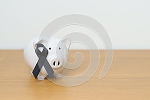 Melanoma and skin May cancer month, Black Ribbon with Piggy Bank for support illness life. Health, Donation, Charity, Campaign,
