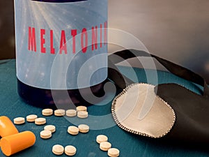 Vitamine D capsules near plastic conainer and medical face masks on the table