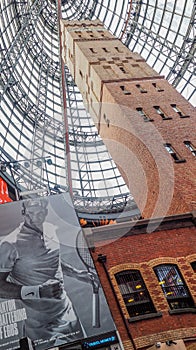 Melbourne Central shot tower with huge advertisment of Roger Federer