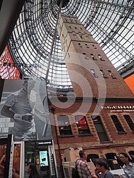 Melbourne Central shot tower with huge advertisment of Roger Federer