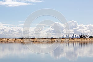 Melbourne skyline, a view from the Brighton Beach with a reflection in the water, Melbourne, Victoria, Australia