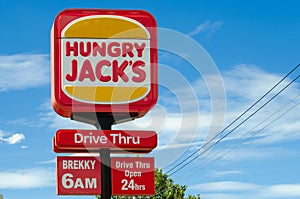 a sign of Hungry Jack`s drive thru. `Brekky` is an Australian slang term for breakfast. Melbourne, VIC/Australia