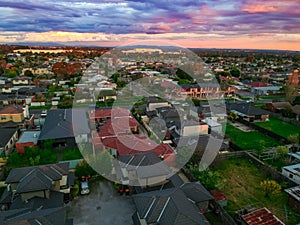 Melbournes suburbs and CBD looking down at Houses roads and Parks Victoria Australia. Beautiful colours at Sunset