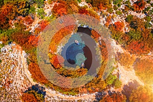 Melissani Cave with autumn colors. Famous Melissani lake on Kefalonia island, Karavomylos, Greece. On top of Melissani Cave