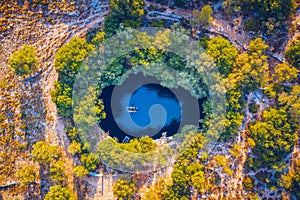 Melissani lake on Kefalonia island, Greece. Melissani Cave (Melissani Lake) near Sami village in Kefalonia island, Greece. Tourist