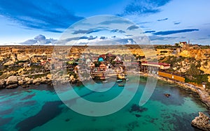 Mellieha, Malta - The famous Popeye Village at Anchor Bay at sunset