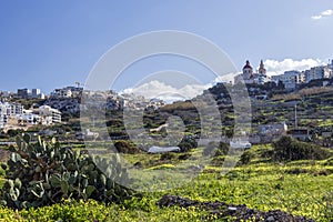 Mellieha village or small town with parish church on the top of the hill in Malta