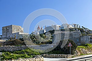 Mellieha village or small town with parish church on the top of the hill in Malta