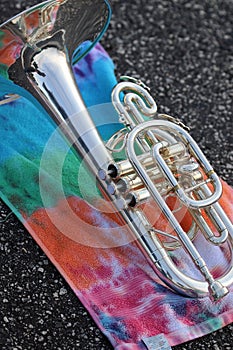 Mellophone on tie-dye towel