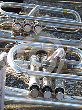 Mellophones on ground during marching band practice close-up