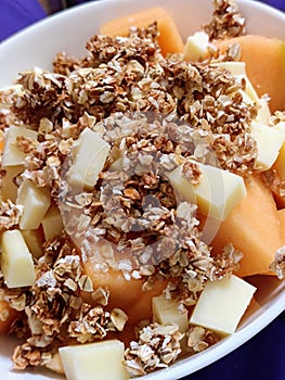 Melon, cheddar cheese and oatmeal granola