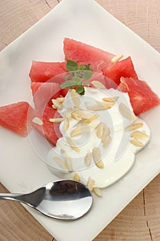 Melon with cream fresh and almond slivers