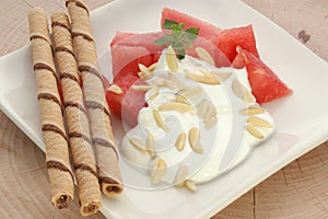 Melon with cream fresh and almond slivers