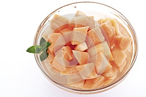 Melon cubes in bowl, close-up