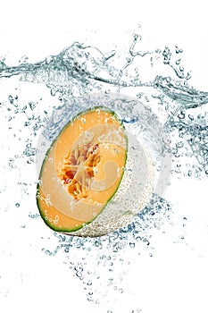 Melon falling in water