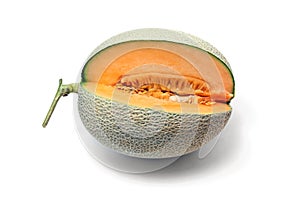 Melon fruit cut to show flesh and seeds on white background.