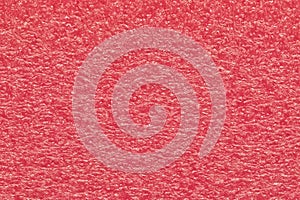 Melon pink expanded polyethylene foam sample background.