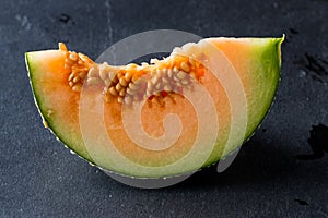 Melon slice on rock plate