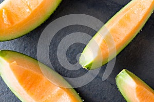 Melon slice on rock plate