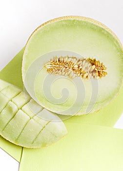 Melon slices on green textile