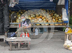 Melon vendor on a market in Chiang Mai