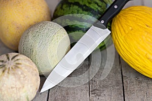 Melons with knife