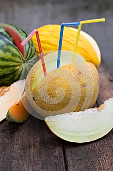 Melons with straws