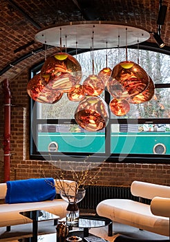 Melt glass pendant lights at the Tom Dixon flagship store and showroom at Coal Drops Yard, Kings Cross, London UK