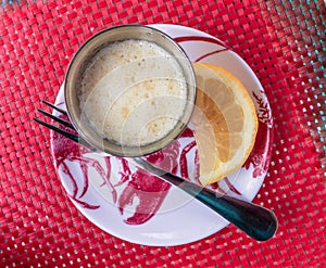 Melted butter and lemon in a side dish prepared for lobster meat