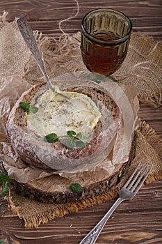 Fondue in camembert bread photo