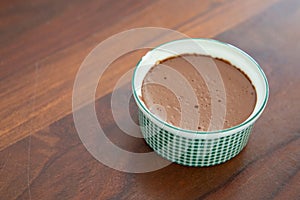 Melted chocolate mousse swirl cocoa dessert in pot