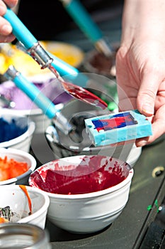 Melted Crayons Are Poured Into Mold For Art Project