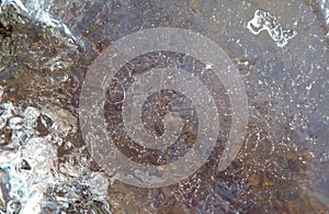 melted ice on the river in winter